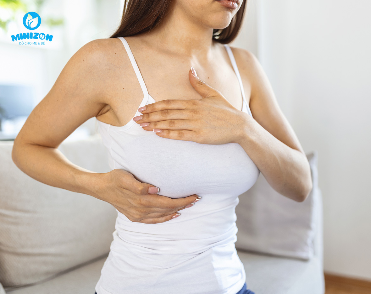 Cho bé bú bên ngực không bị thương Cho bé bú bên ngực không bị thương